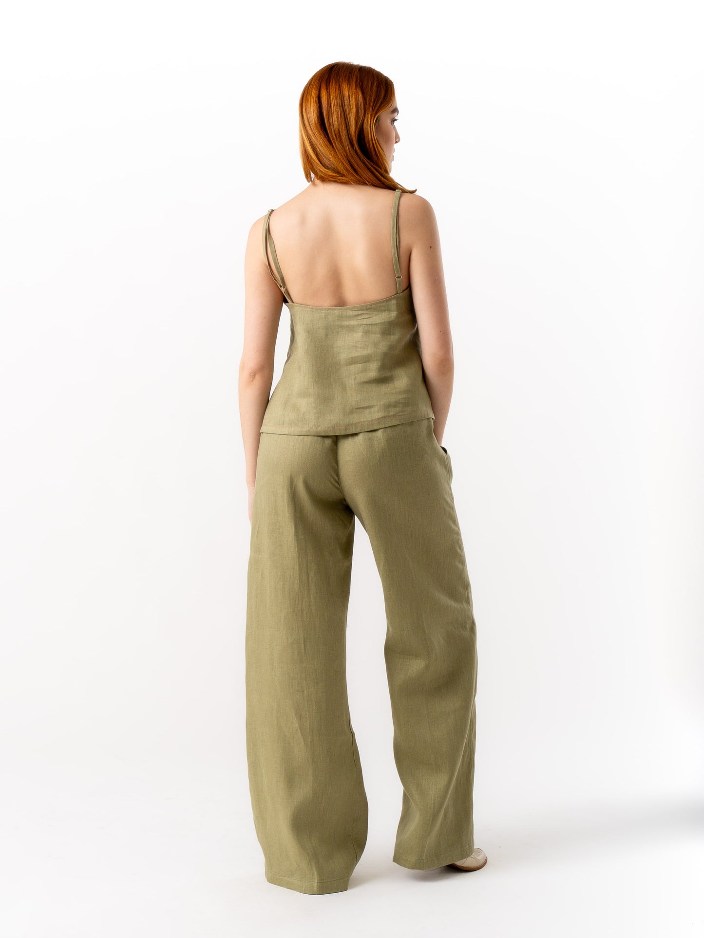 woman wearing olive green linen top