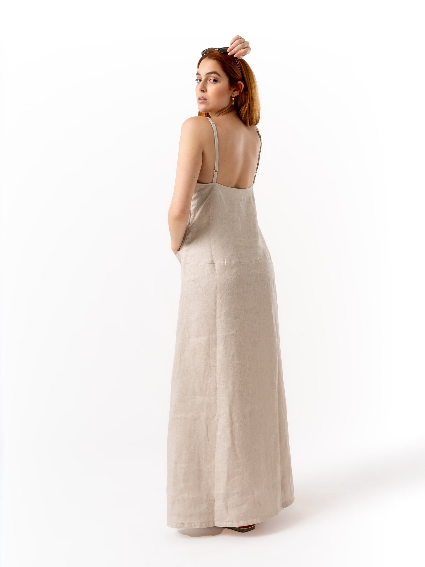 Woman wearing high quality linen long dress in beige