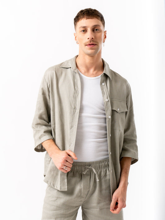 Man wearing high quality linen shorts and shirt in grey