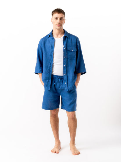 Man wearing high quality linen shorts and shirt in blue