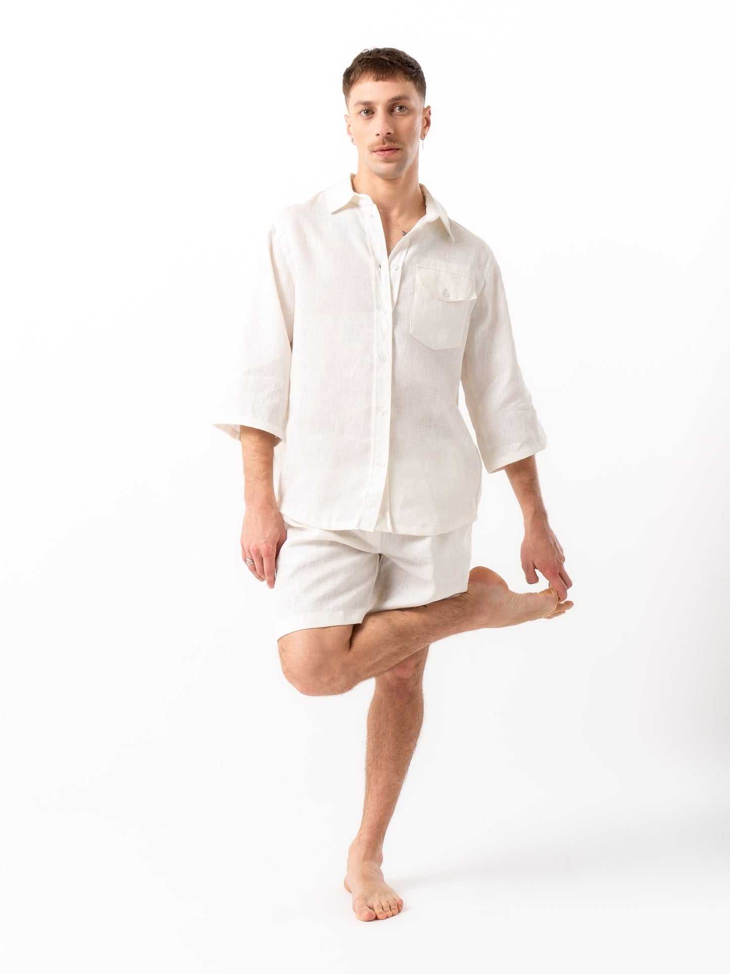 Man wearing high quality linen shorts and shirt in white