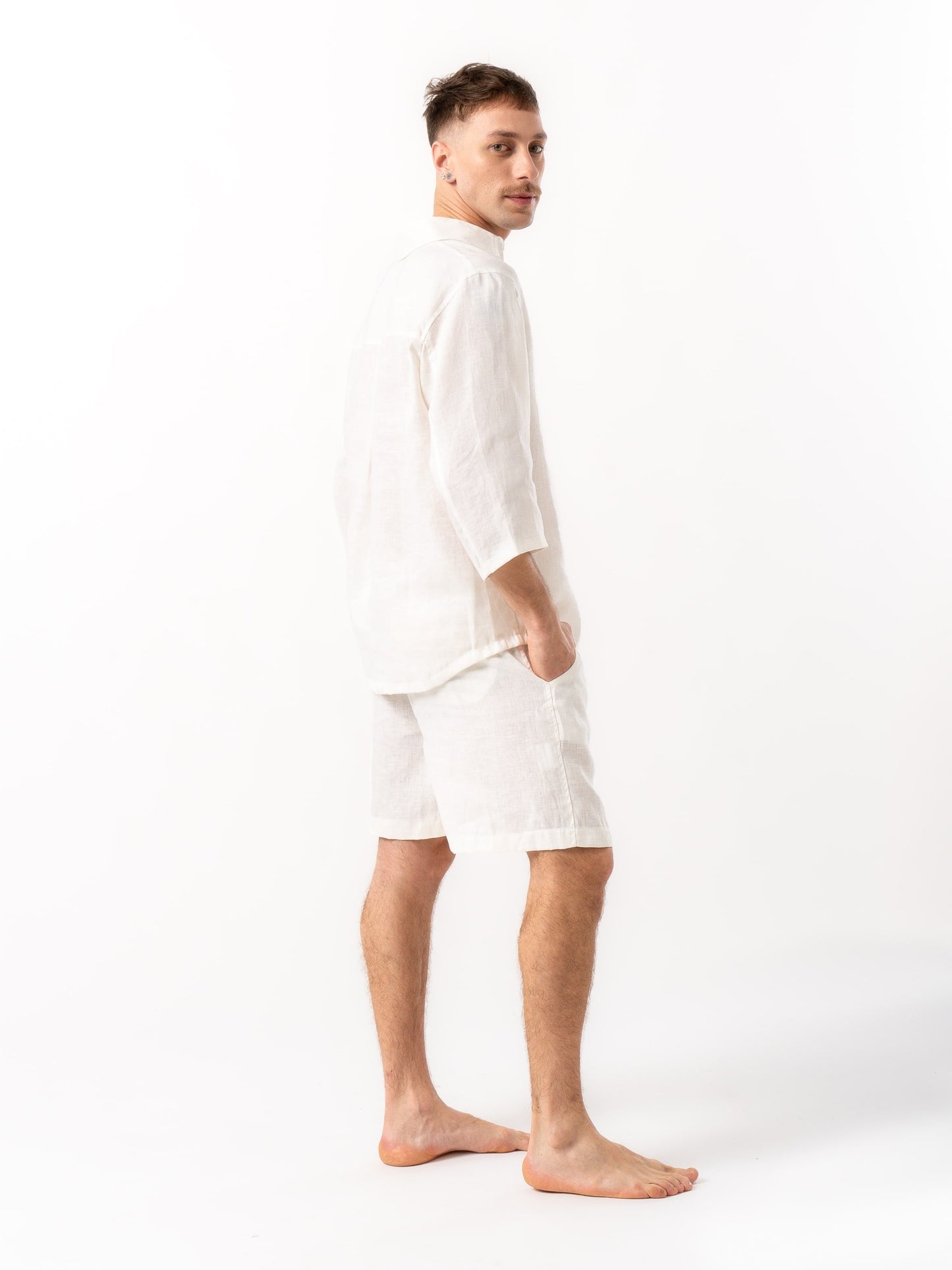 Man wearing high quality linen shorts and shirt in white