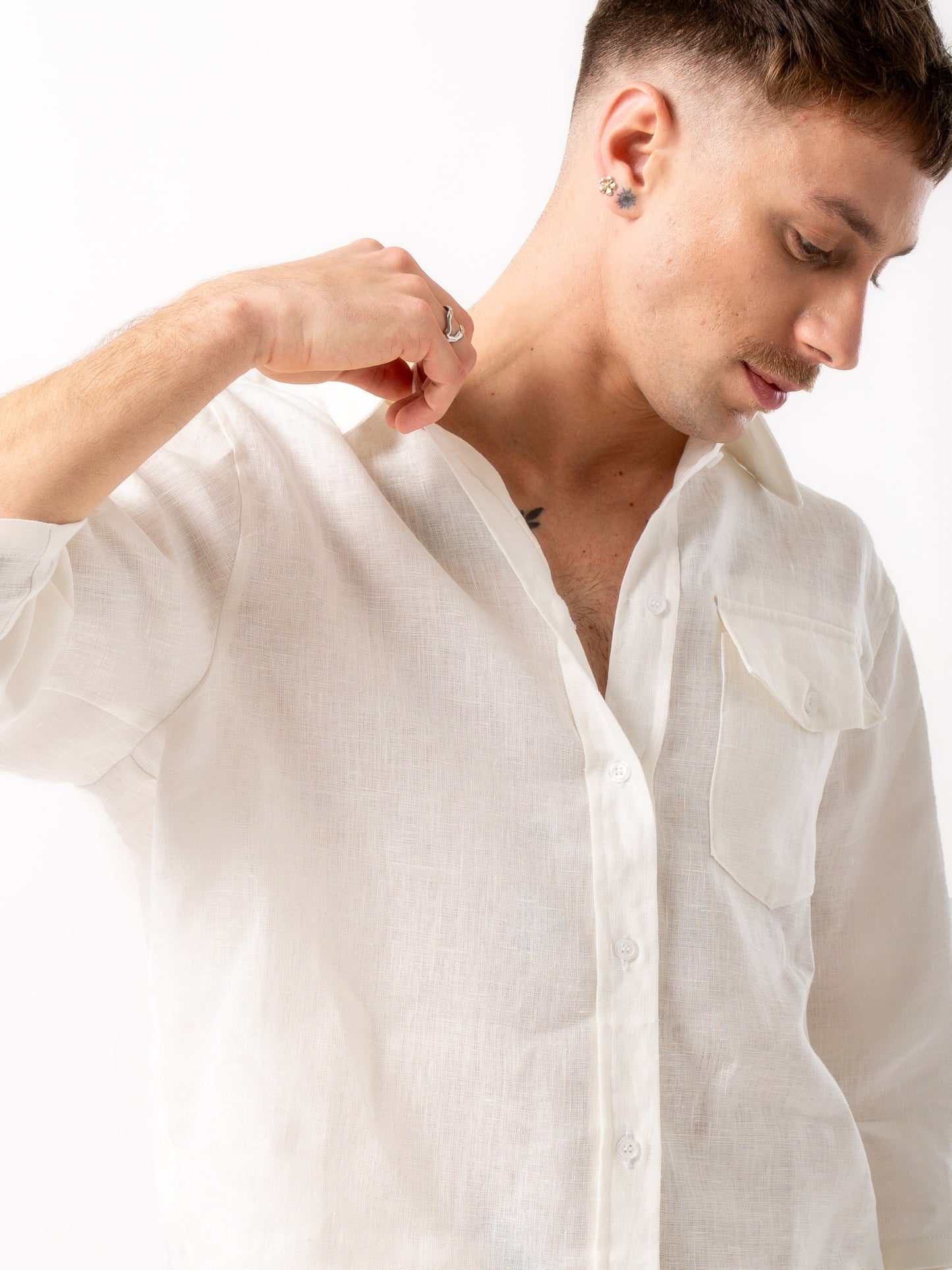 Man wearing high quality linen shorts and shirt in white