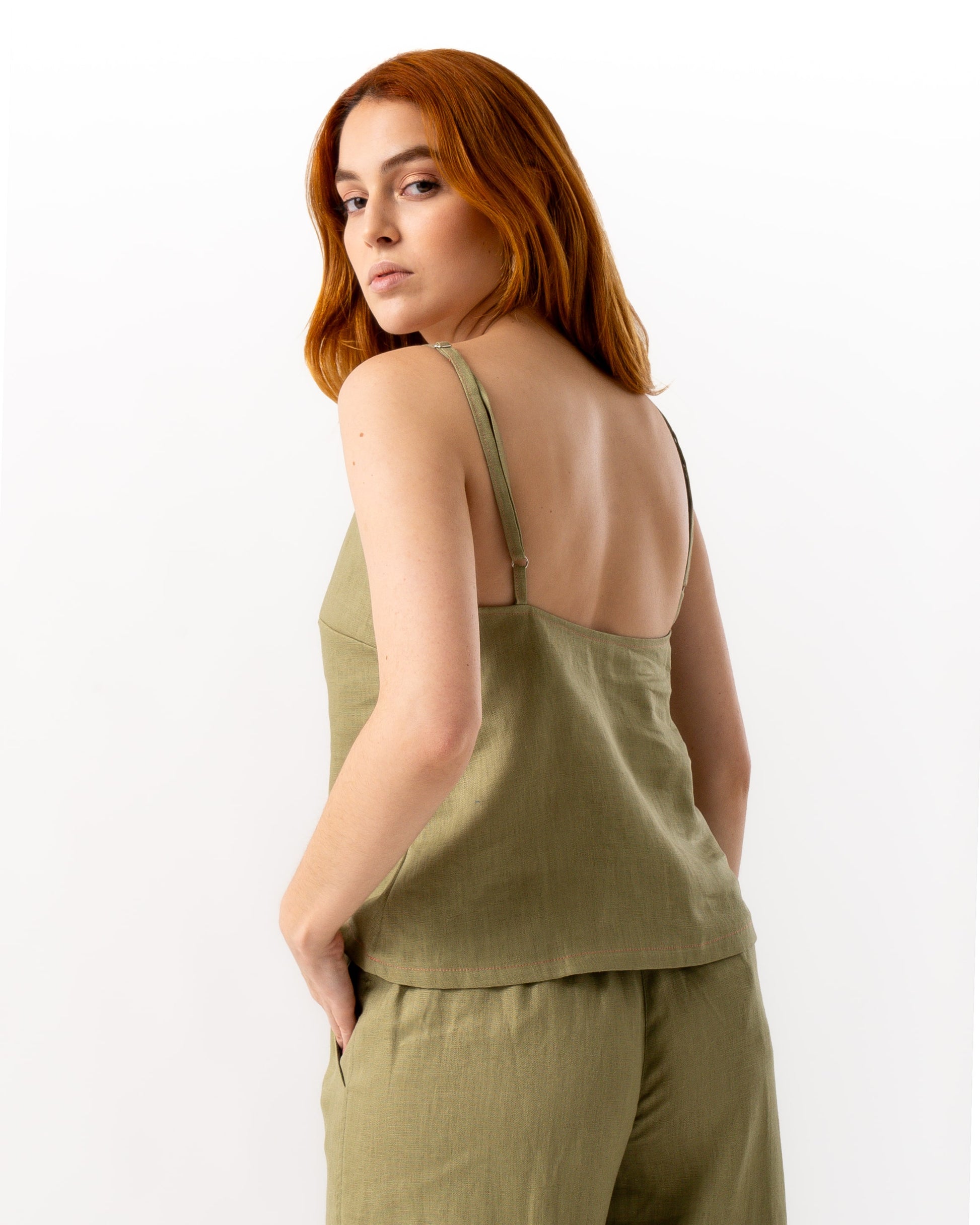 woman wearing olive green linen top