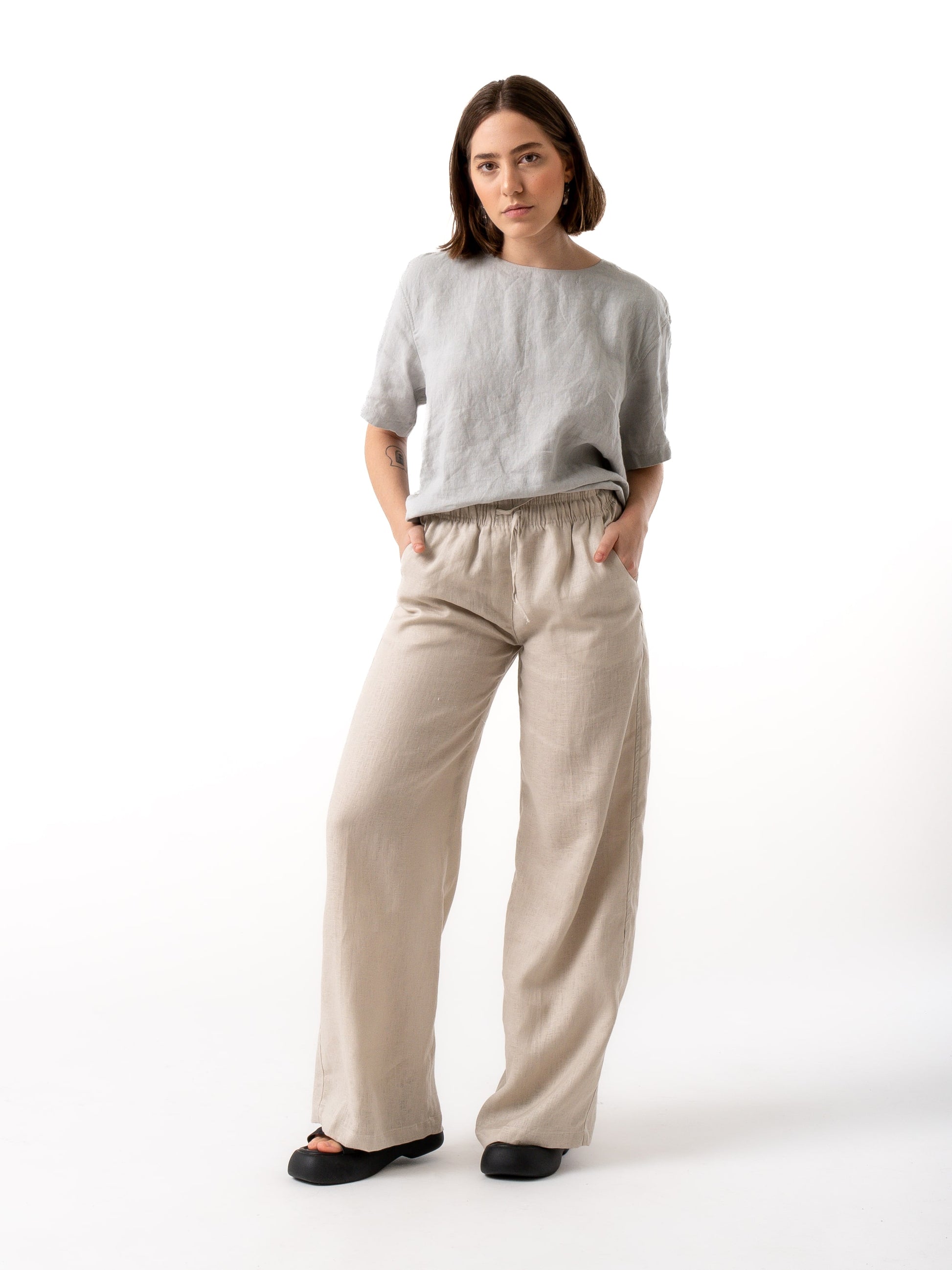 woman wearing beige linen pants