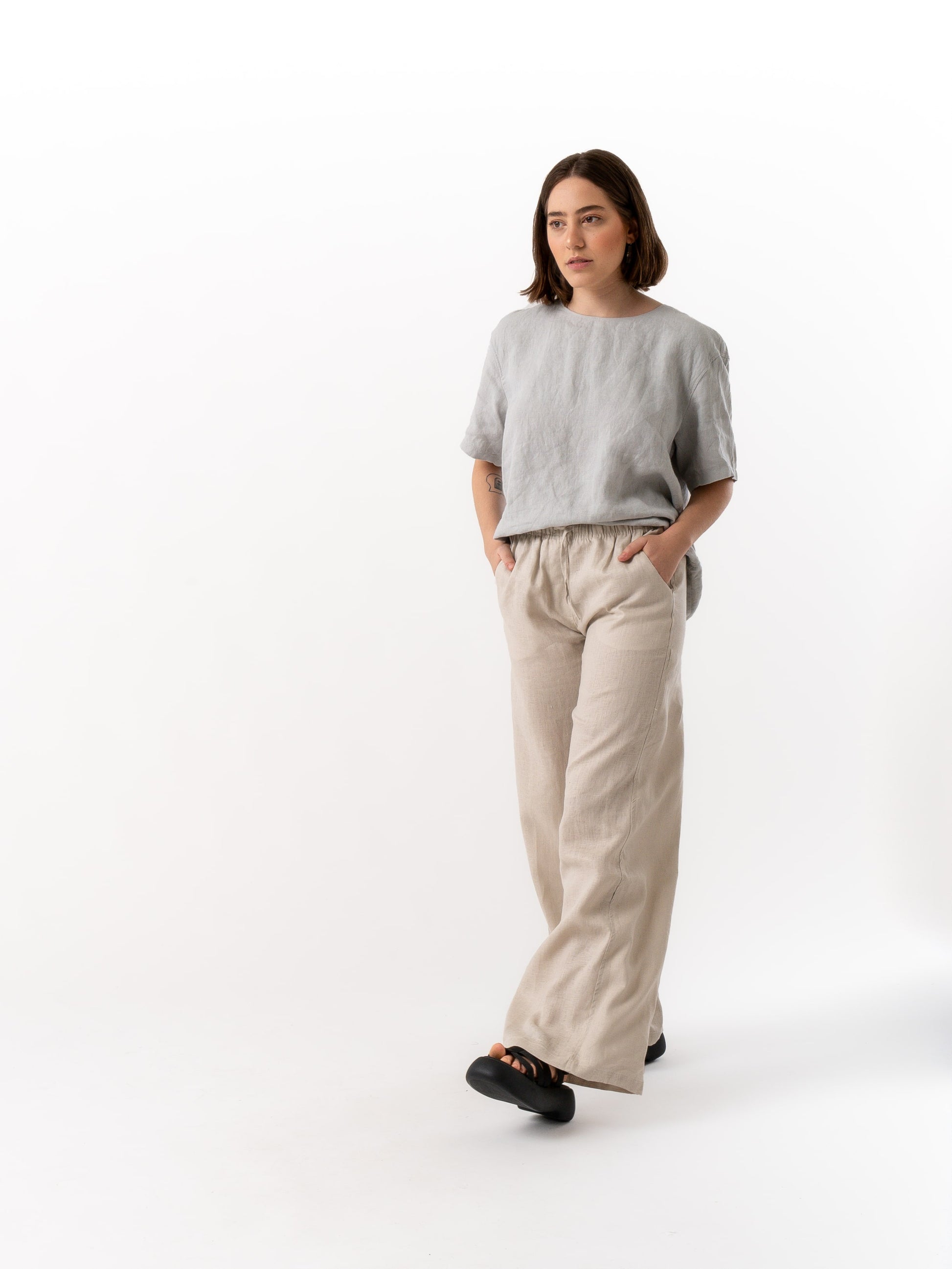 woman wearing beige linen pants