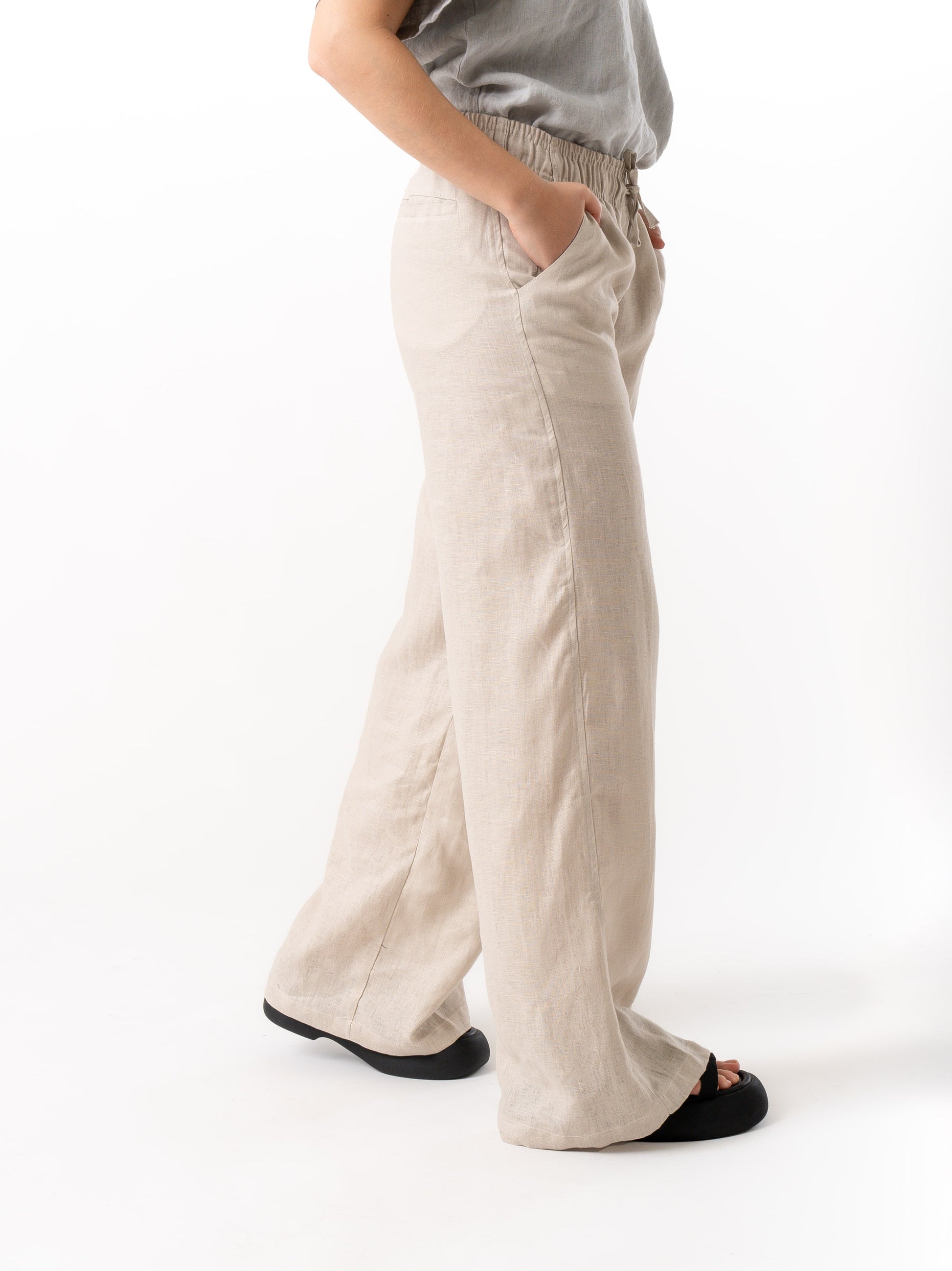 woman wearing beige linen pants