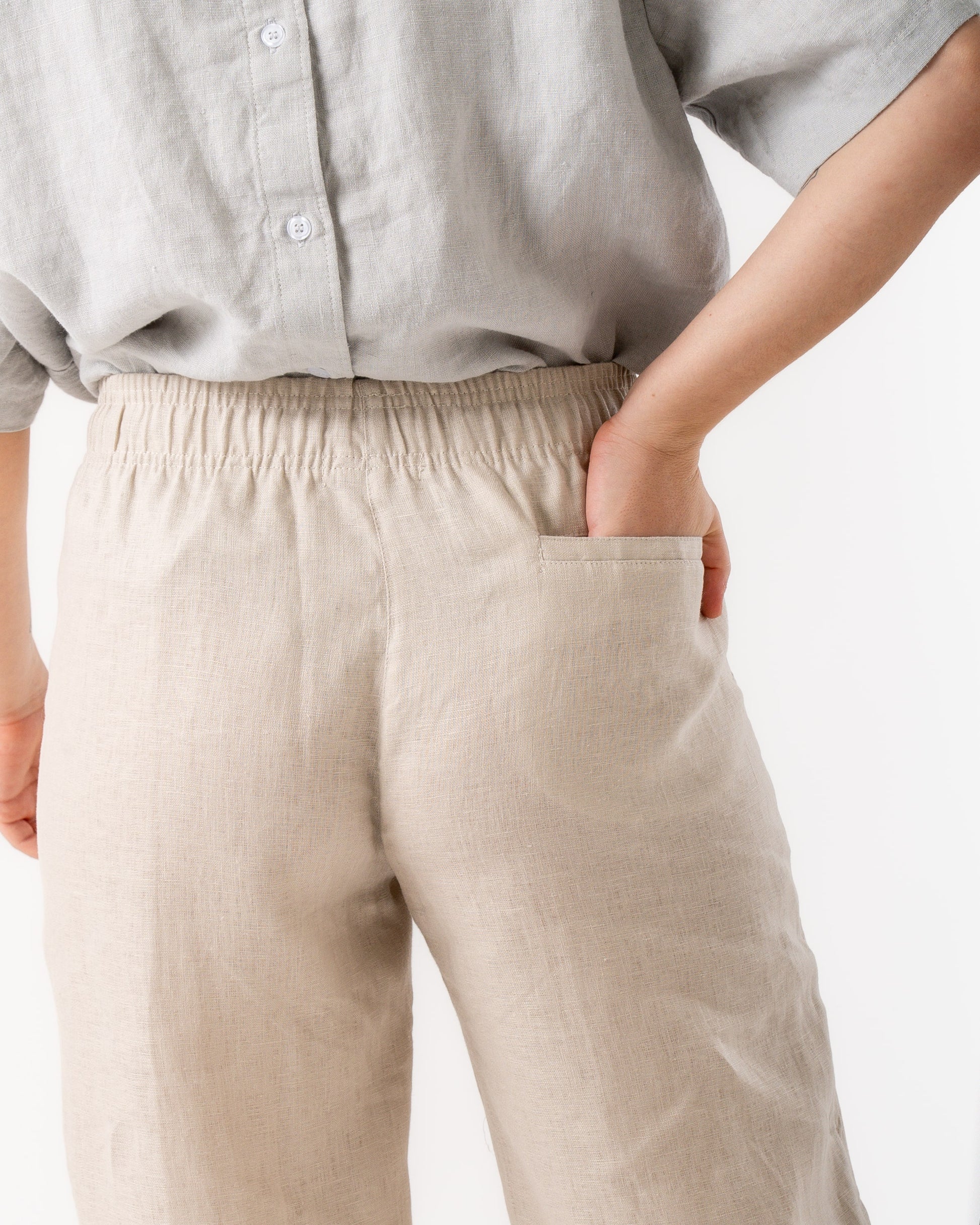 woman wearing beige linen pants