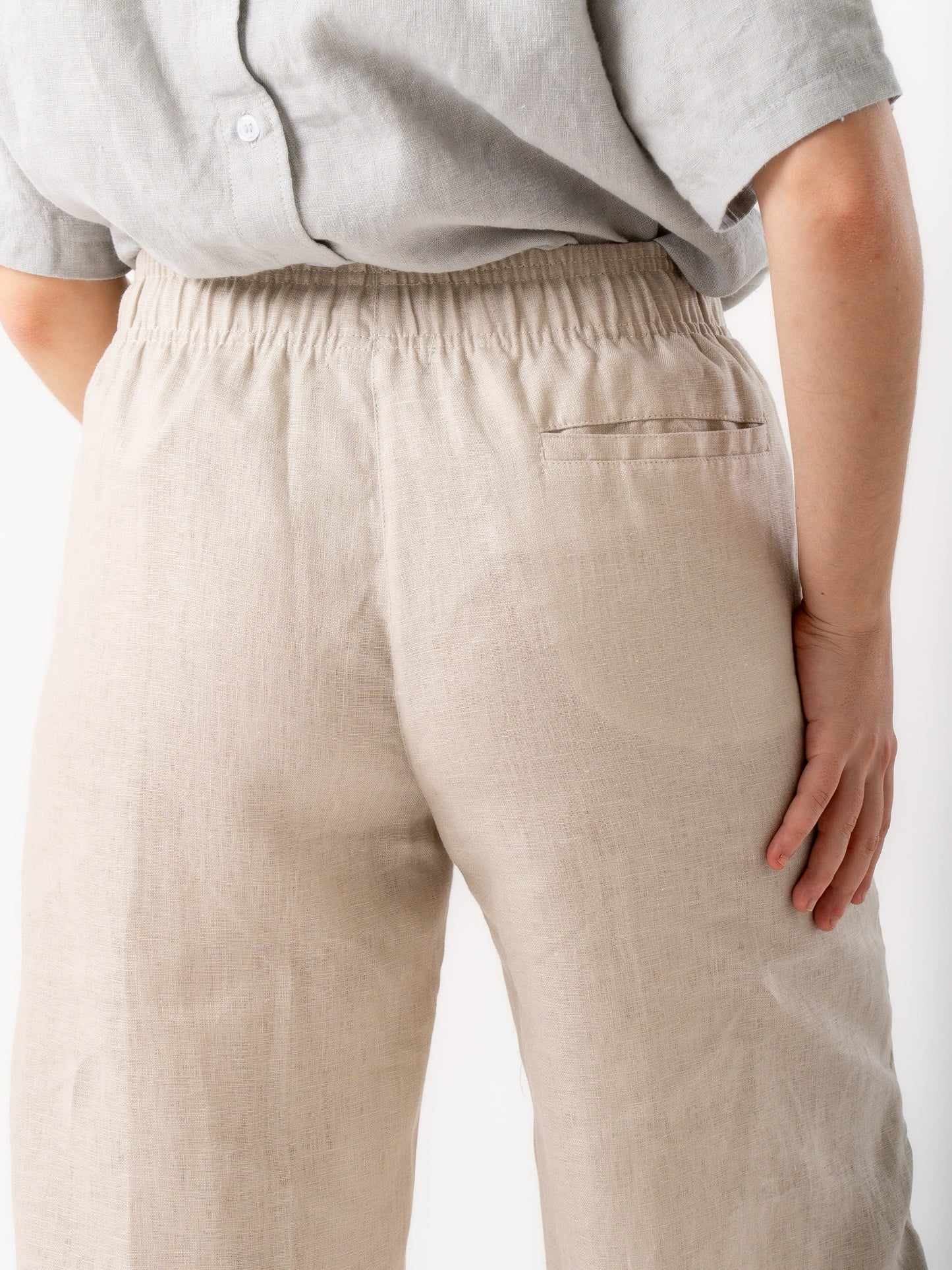 woman wearing beige linen pants