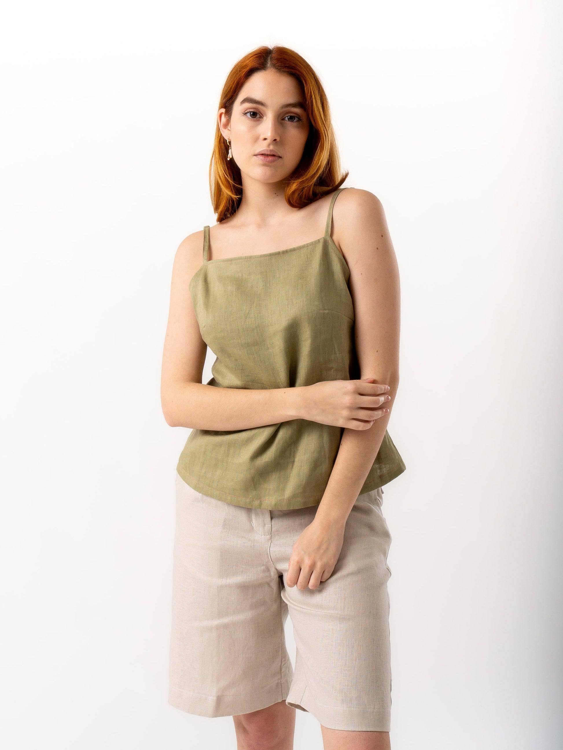 woman wearing olive green linen top