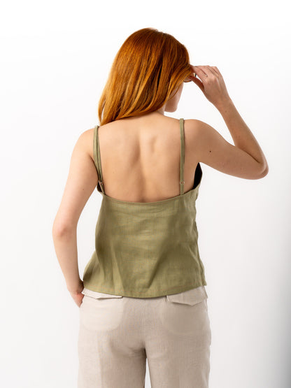 woman wearing olive green linen top